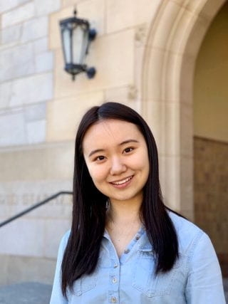 Weijia Shi in front of Gearhart Hall