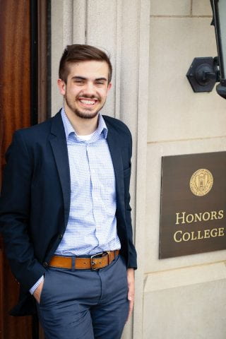 Jacob Huneycutt in front of Gearhart Hall